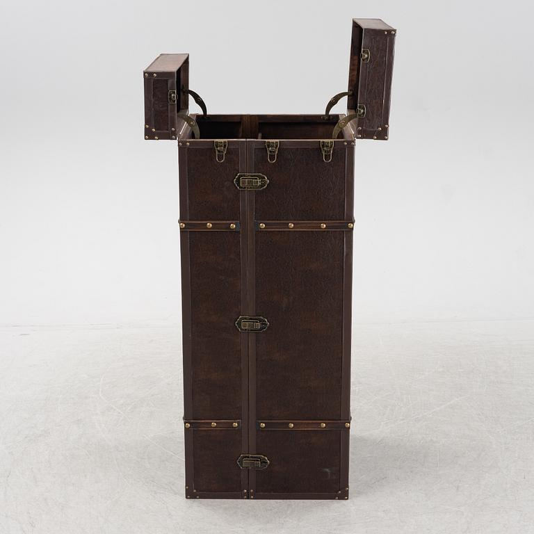 A leather suitcase-shaped bar cabinet.