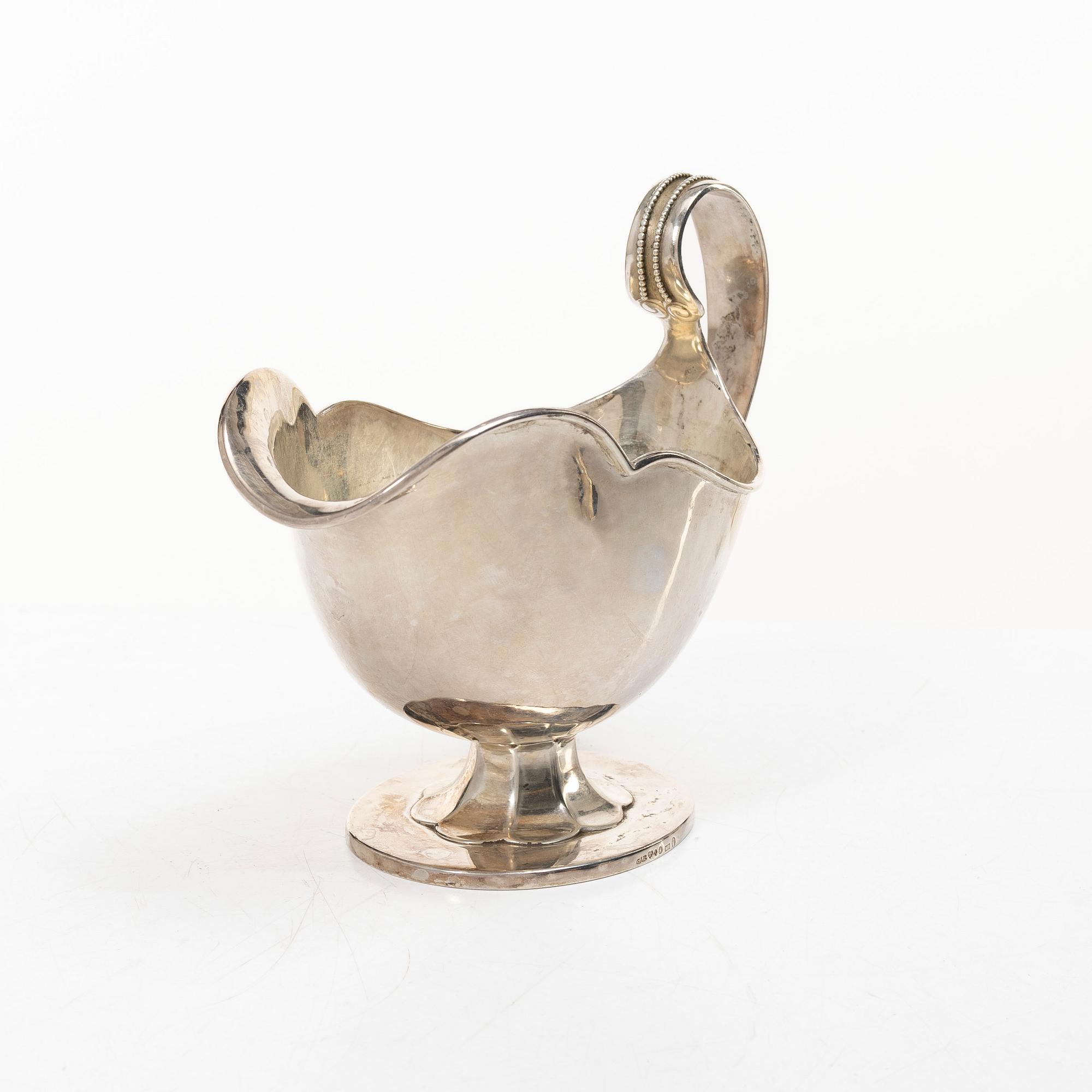 Sauceboat and four punch cups, silver, Sweden, 20th century.