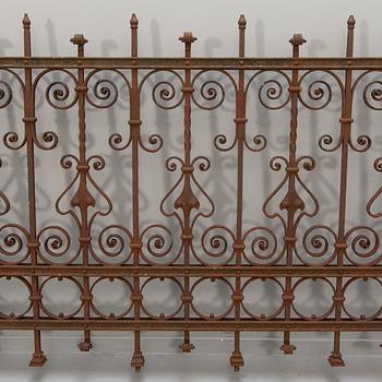 A cast iron two part fence around 1900.