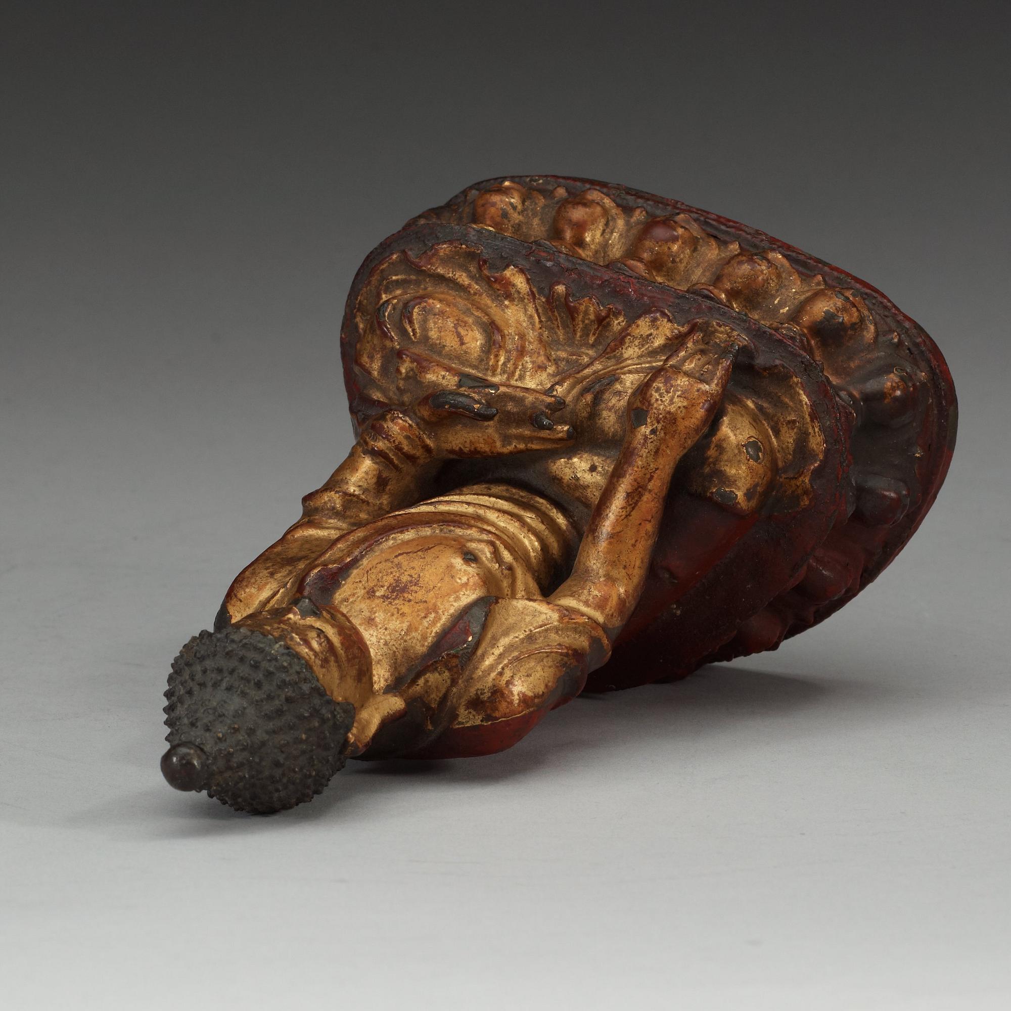 A partly gilt and lacquered figure of Buddha, Qing dynasty (1644-1912).