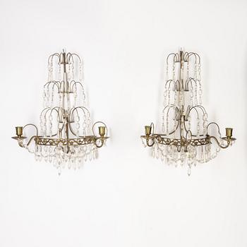 A pair of Gustavian style two-branch wall lights, 20th century.