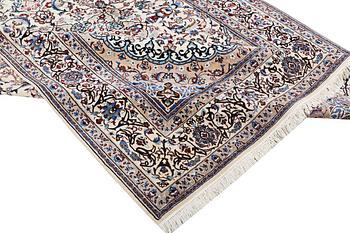 A Nain carpet, part silk, 9 laa, c. 318 x 209 cm.