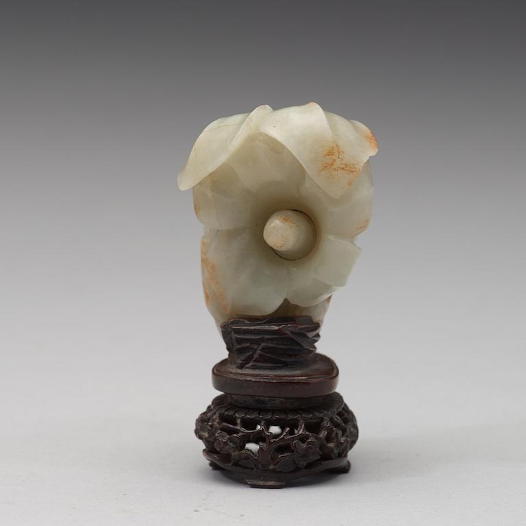 A celadon nephrite floral group, Qing dynasty (1644-1944).