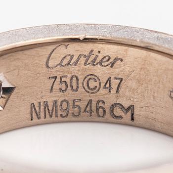 Cartier, an 18K white gold 'Love' ring with three brilliant-cut diamonds.