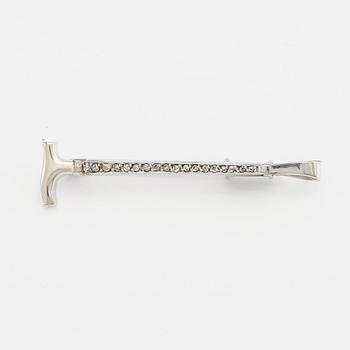 Brooch in 18K white gold shaped like a riding crop with rose-cut diamonds, G. Dahlgren & Co Malmö 1944.