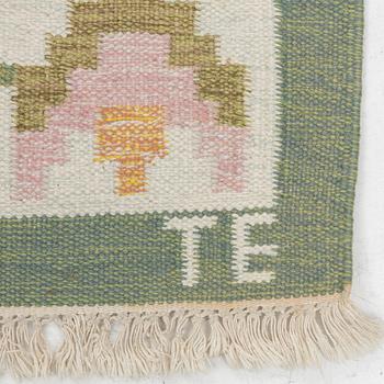 A flat weave carpet, signed TE, c. 224 x 126 cm.