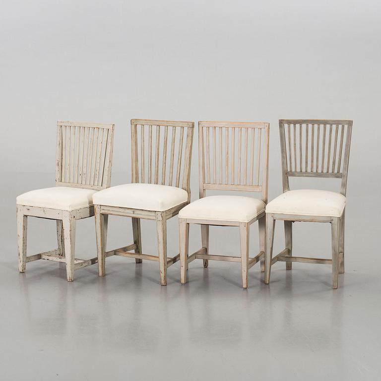 A SET OF 4 PIN SIMILAR CHAIRS.