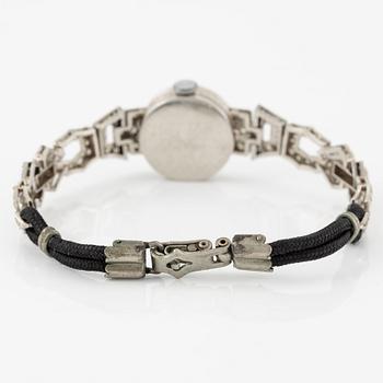 Damarmbandsur, platina med åttkantslipade diamanter, med textilrem.