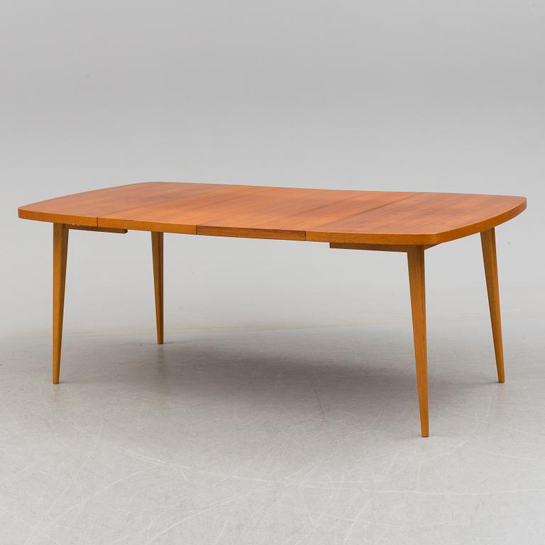 A 1950s teak and teak veneer table.