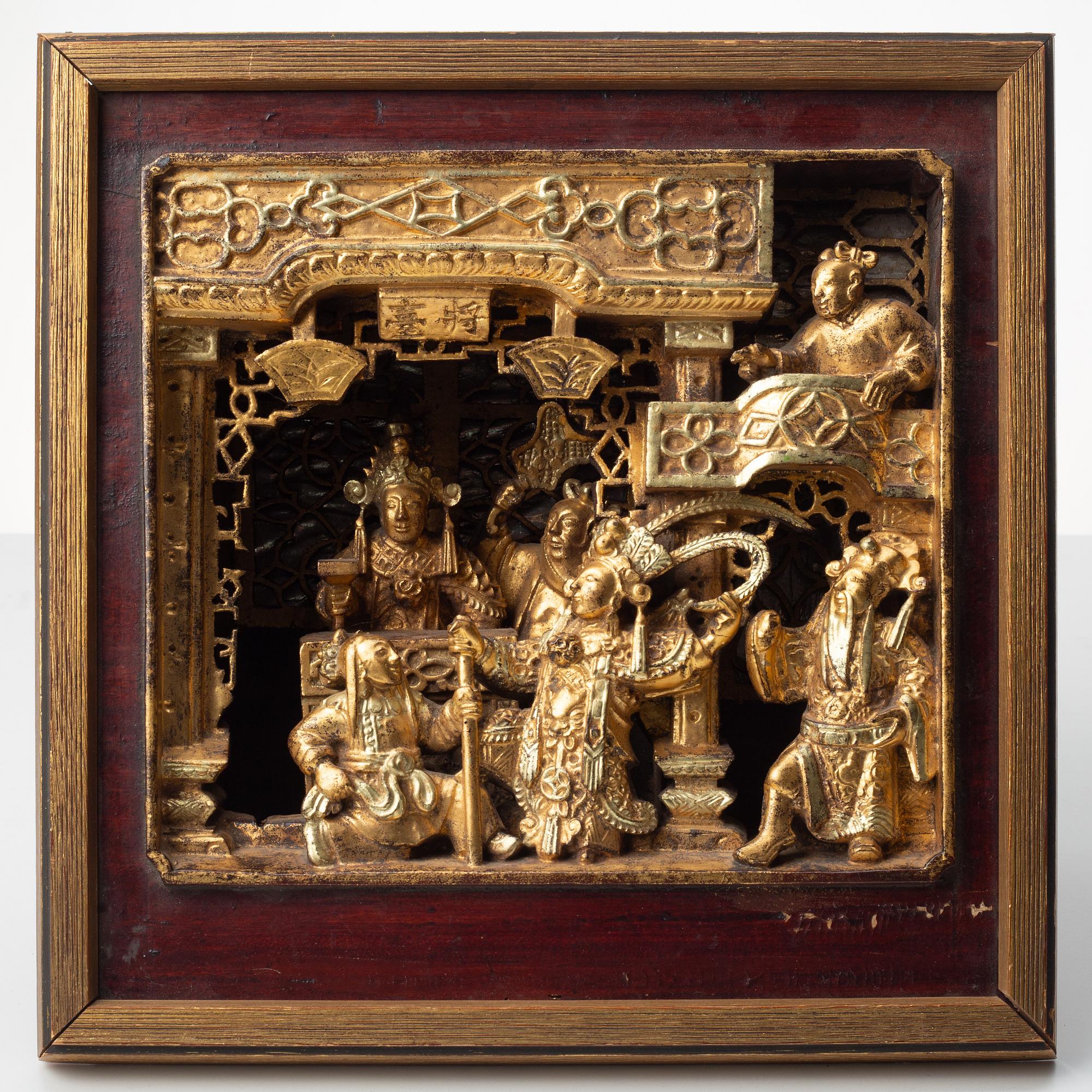 A Chinese wooden panel in deep relief, Qing dynasty, 19th century.