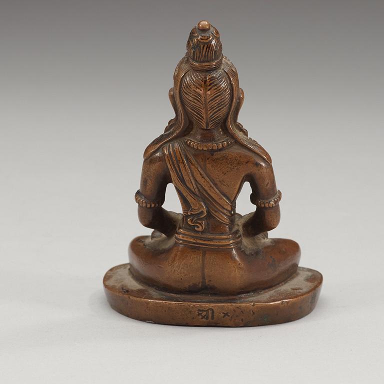 A copper alloy figure of Amitayus, Tibet/Nepal, presumably late 19th century/early 20th century.
