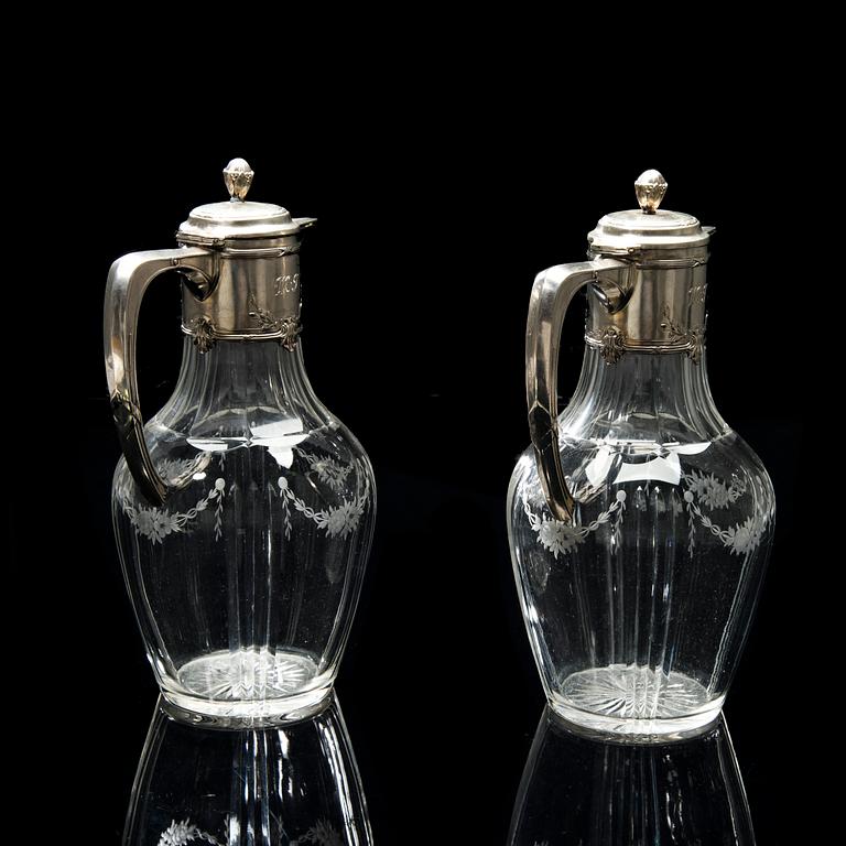 A PAIR OF WINE PITCHERS, silver and glass, Germany, Finnish import marks V. Lindman Helsinki 1909.