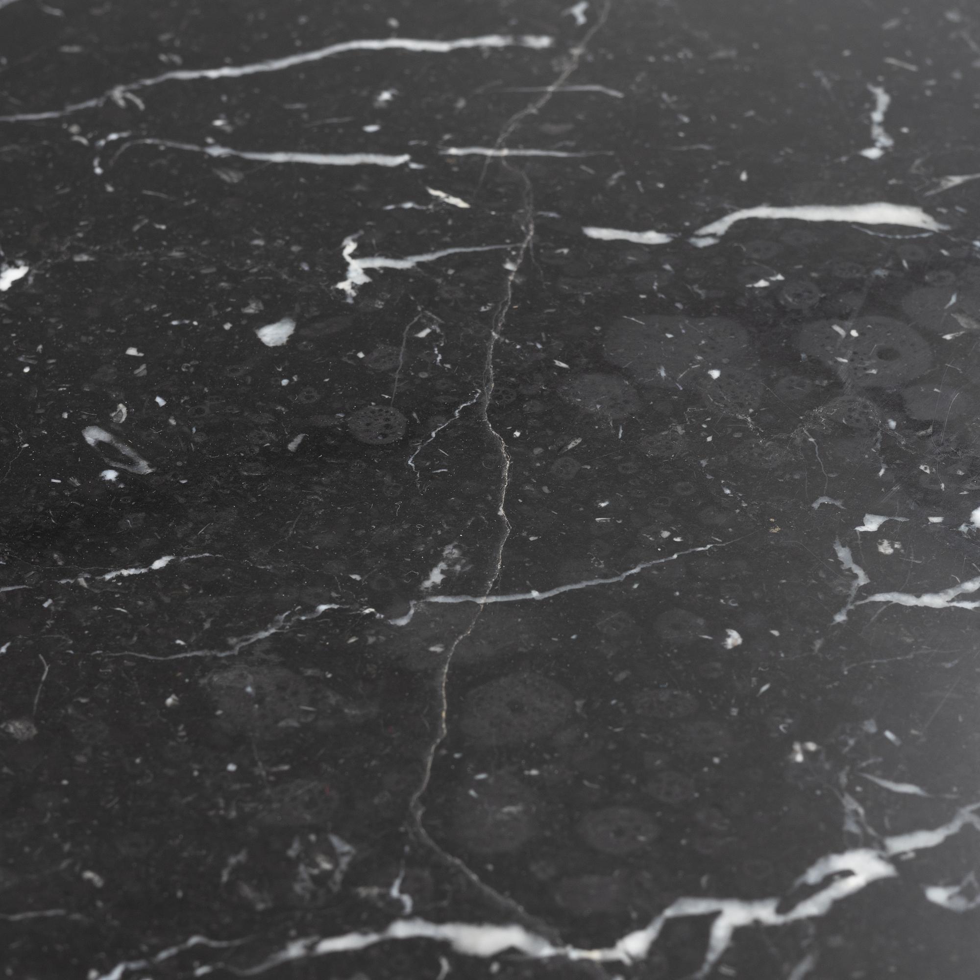 Louise Roe, a 'Roundabout' dining table with marble top.