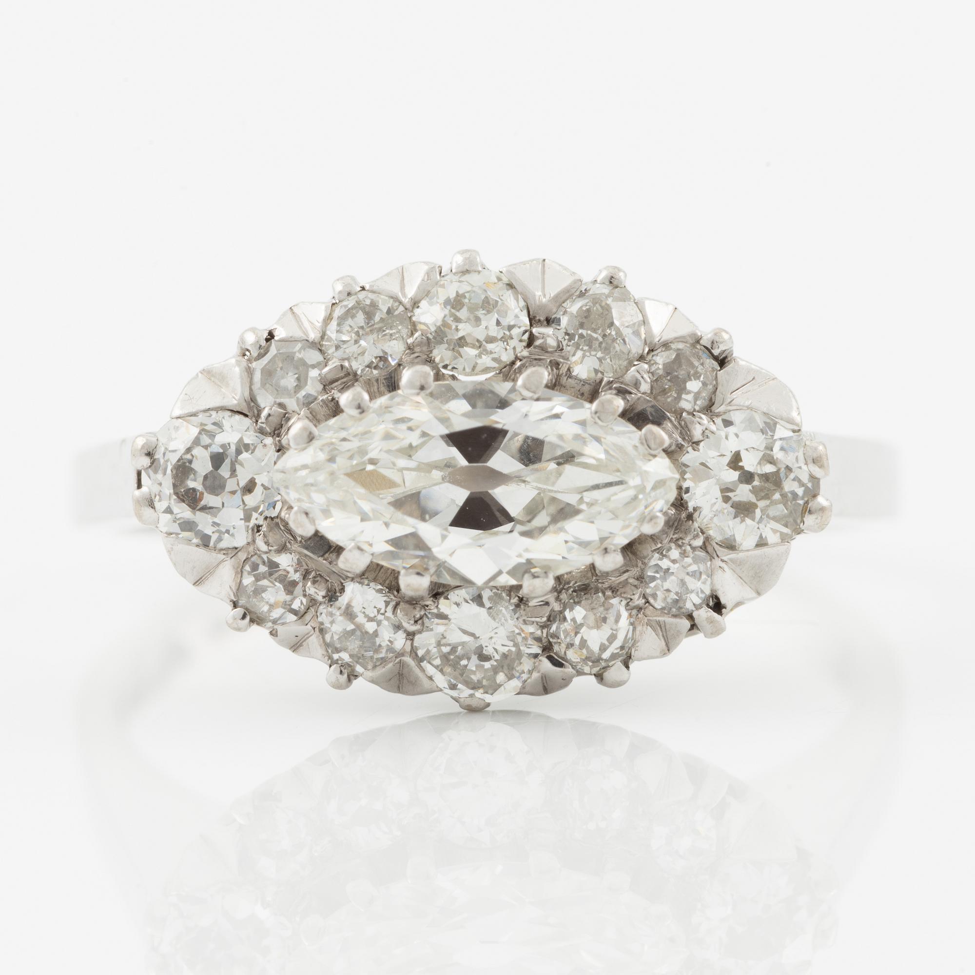 Ring in 18K white gold set with a marquise-cut diamond and old-cut diamonds.