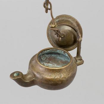 A 18th century oil lamp.