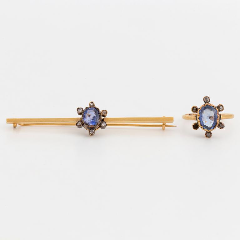 An 18K gold brooch and ring set with oval, mixed-cut sapphires and rose-cut diamonds.