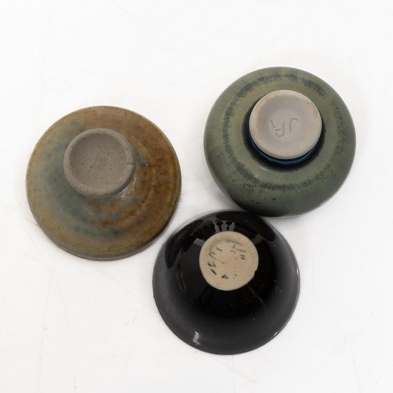 A set of fourteen stoneware vases and ten bowls, predominantly John Andersson, Höganäs.