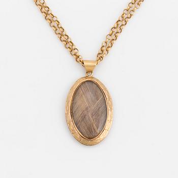 A chain and locket with hairwork.