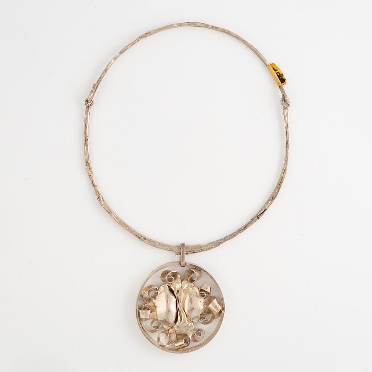 Lars Arby, three neck rings with pendants, silver, Gothenburg including 1977, 1978, and 1982.