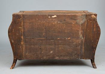 A ROCOCO CHEST OF DRAWERS.