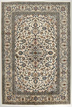 A Keshan rug, 305 x 199 cm.