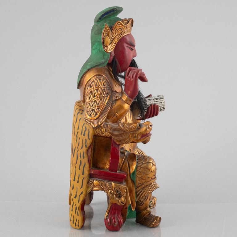 A Chinese lacquered wood figure, 20th century.