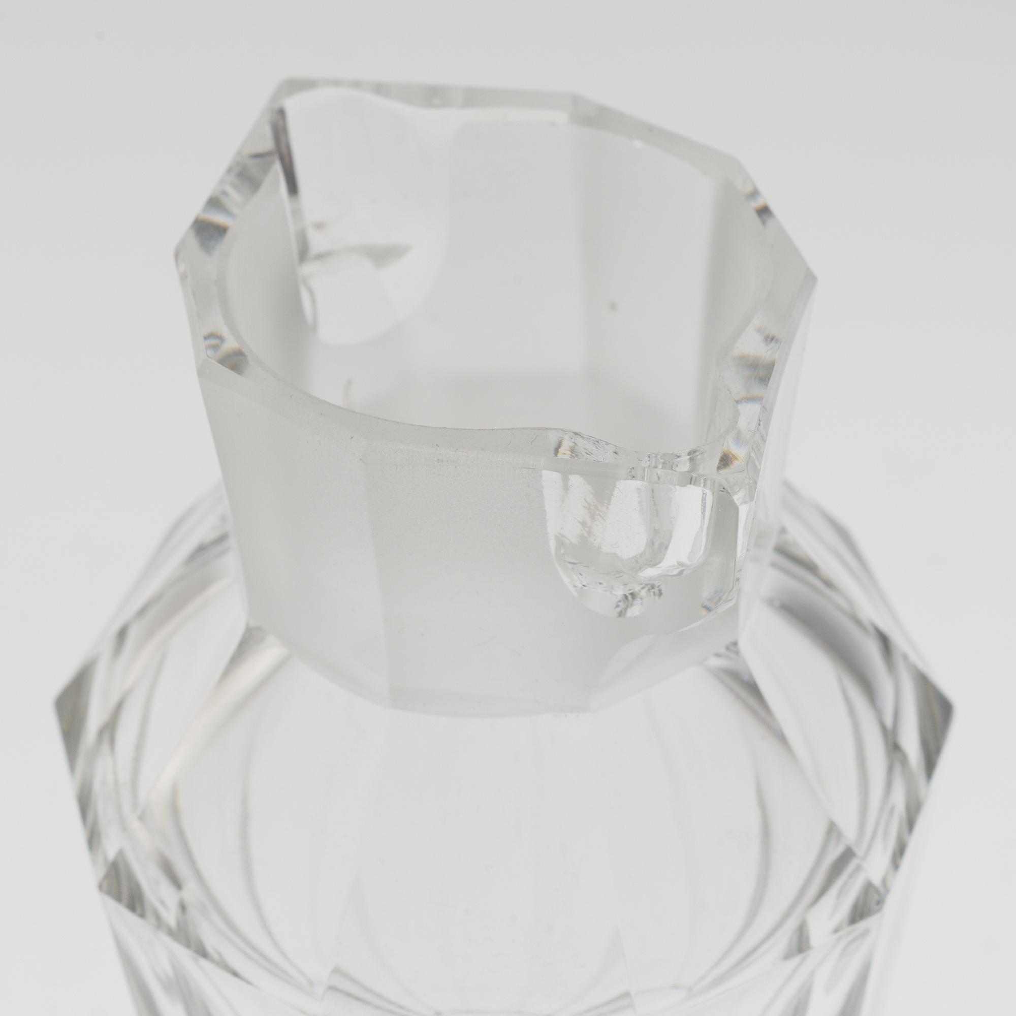 A set of twelve glasses and a cocktailshaker by Elis Berg, Kosta.