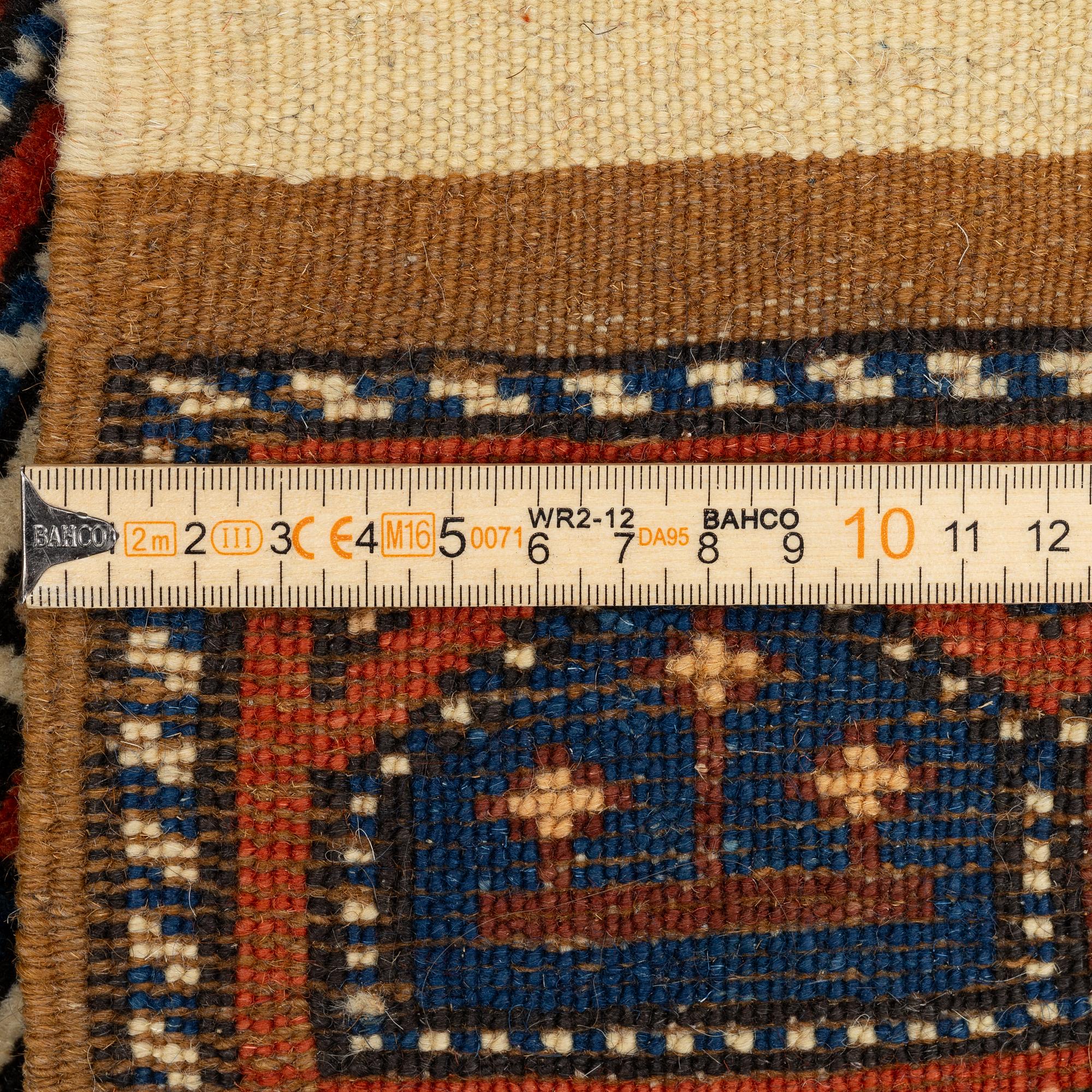 A pair, semi-antique rug, Döşemealtı, Antalya region, Turkey, ca 75 x 77 cm.