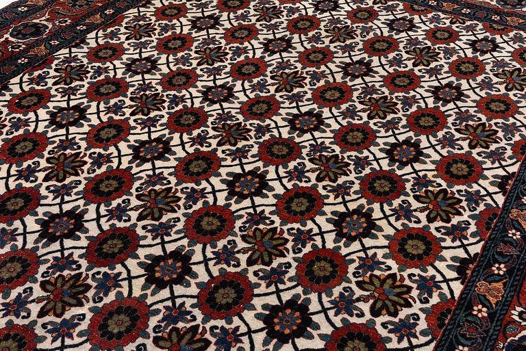 An antique Veramin carpet, West Persia, 380 x 271 cm.
