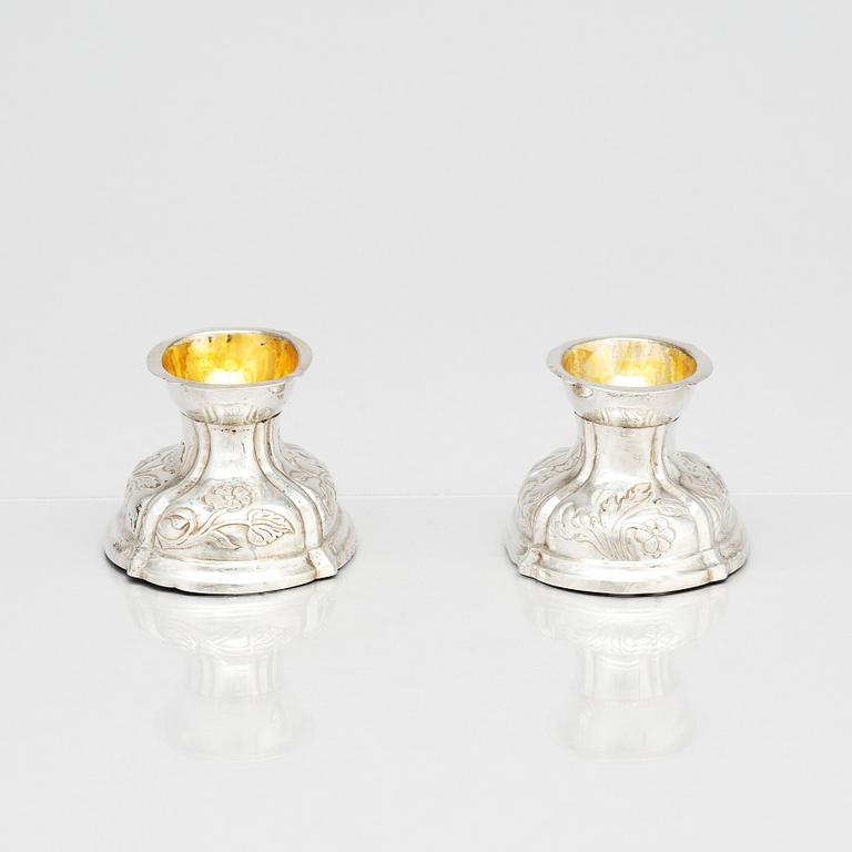 A pair of German rococo parcel-gilt silver salt-cellars, 18th century.