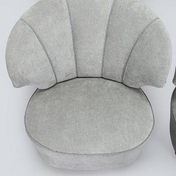 A pair of mid 20th century armchairs.