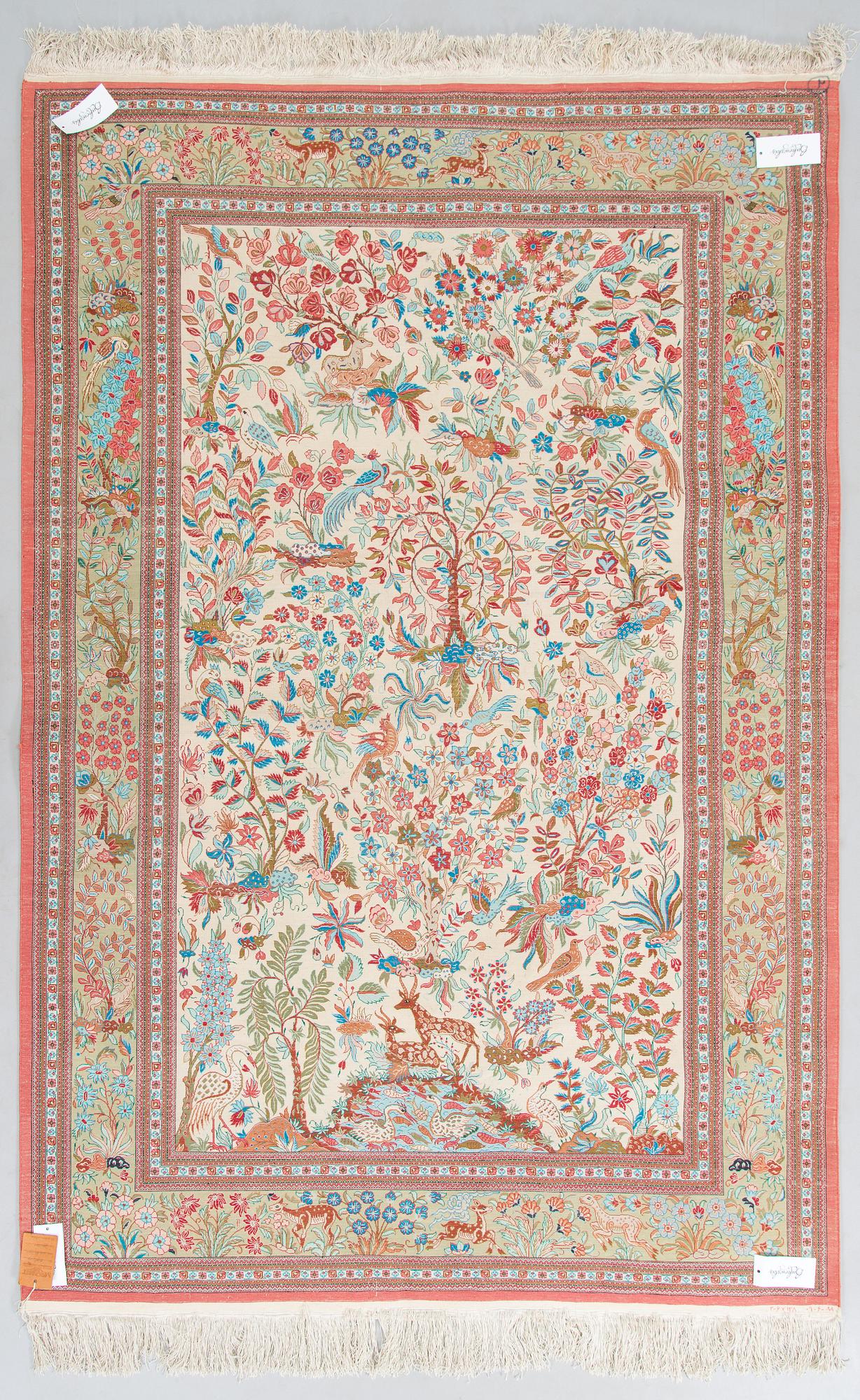 A silk Qum rug, central Persia, c. 210 x 138 cm.