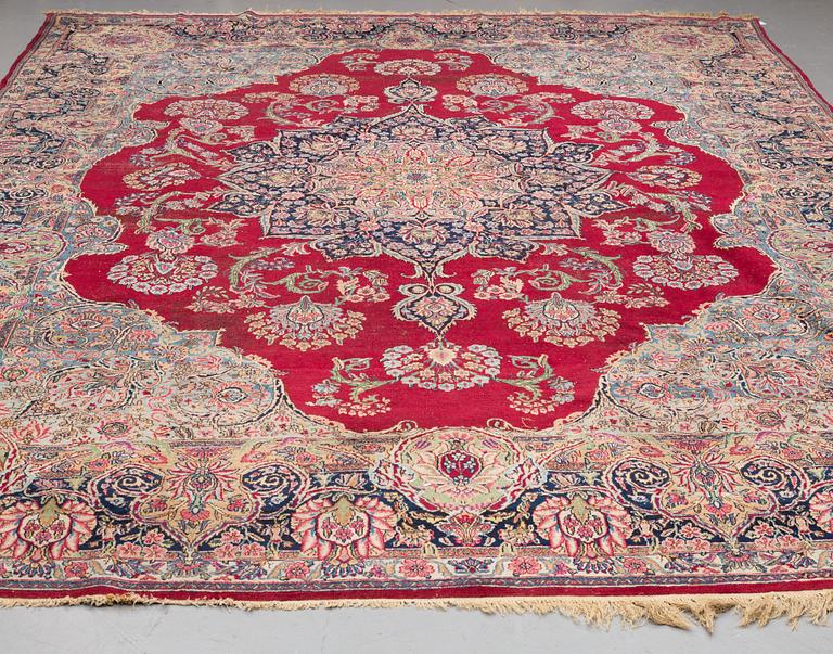 A CARPET, , semi-antique Kerman, ca 431 x 296 cm.