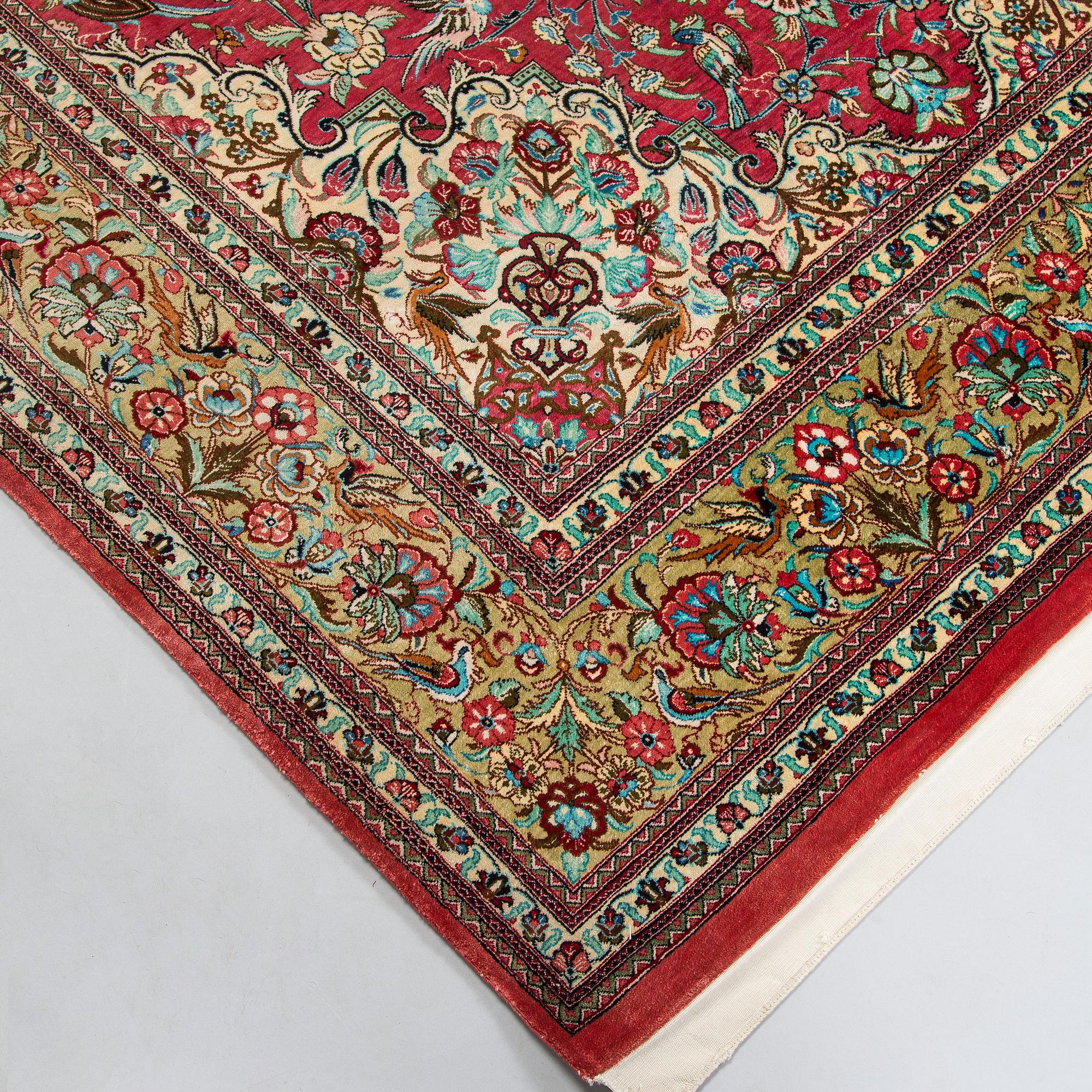 A silk Qum rug, central Persia, approx. 232 x 137 cm.