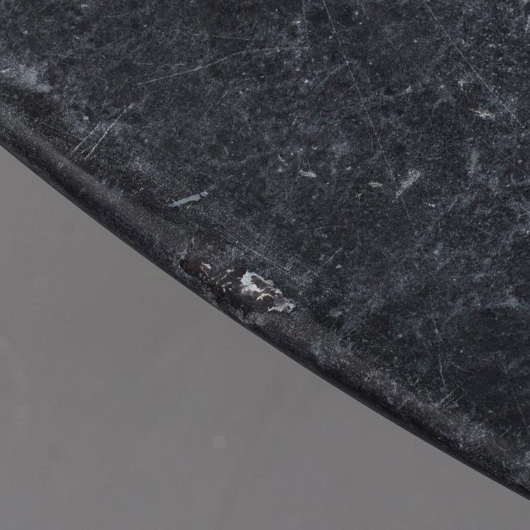 AN EERO SAARINEN "TULIP" TABLE BY KNOLL INTERNATIONAL.