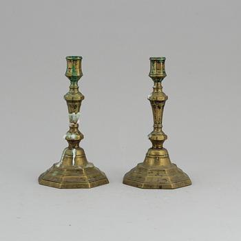 A pair of 18th century brass candlesticks.