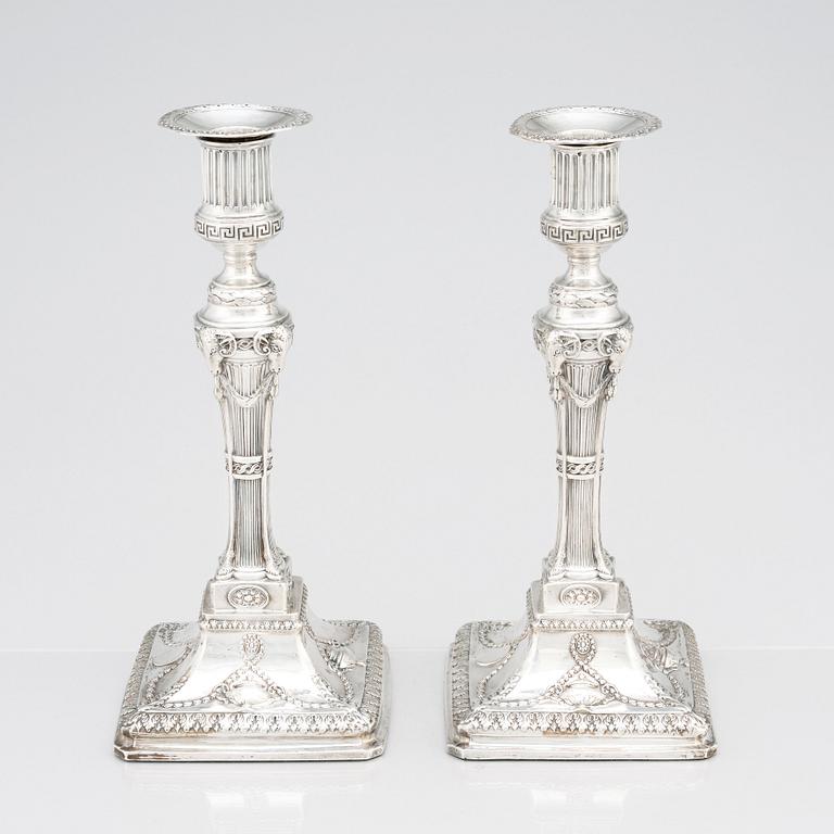 An English pair of 18th Century silver candlesticks, mark of John Winter & Co, Sheffield 1775.