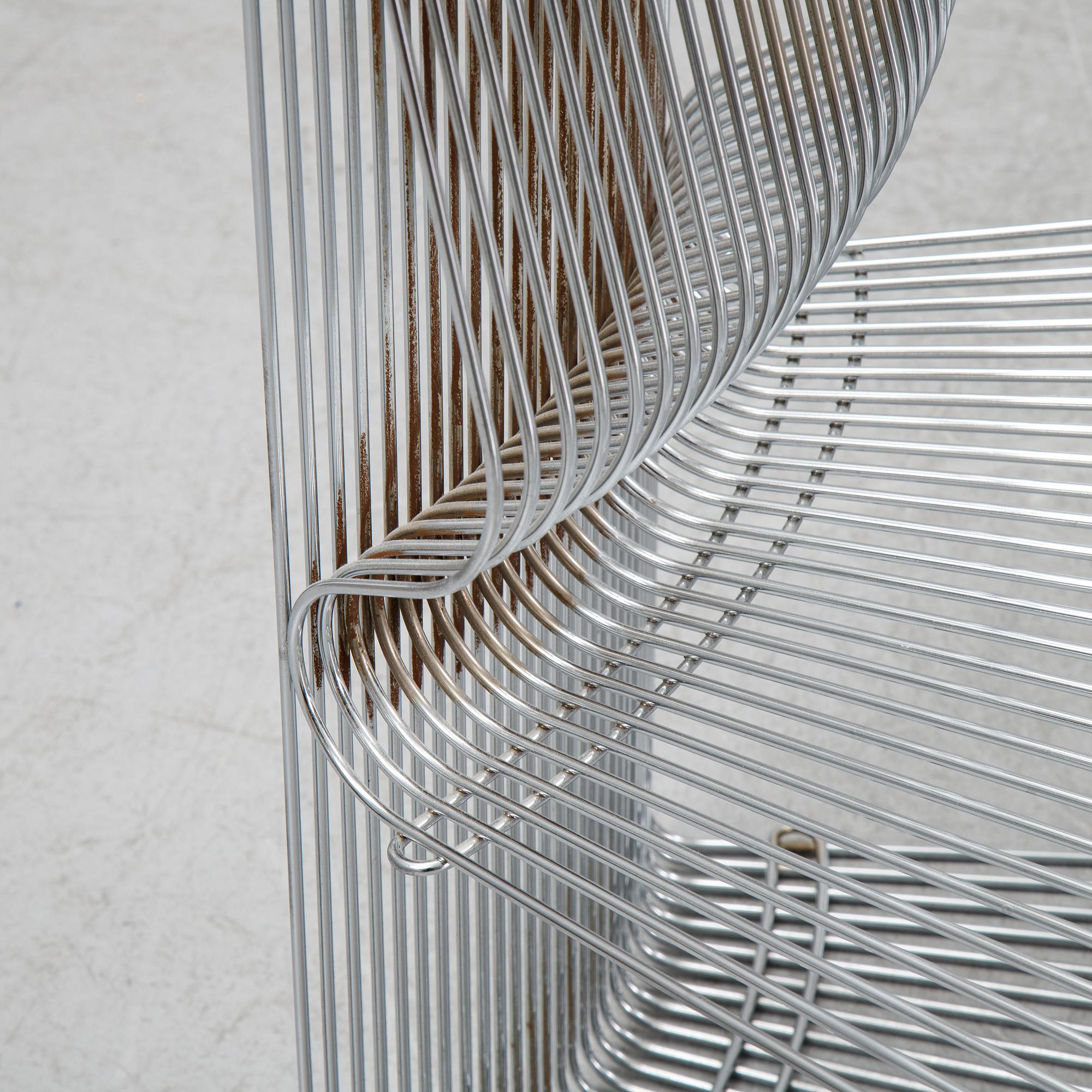 A 'Pantanova convex' chair with foot stool and a 'Wire Extendted' shelf, Verner Panton, Montana, Denmark.