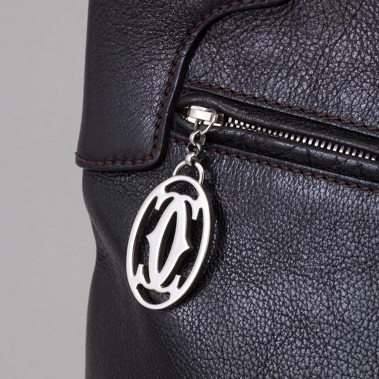 A bag "Marcello Reporter" by Cartier.