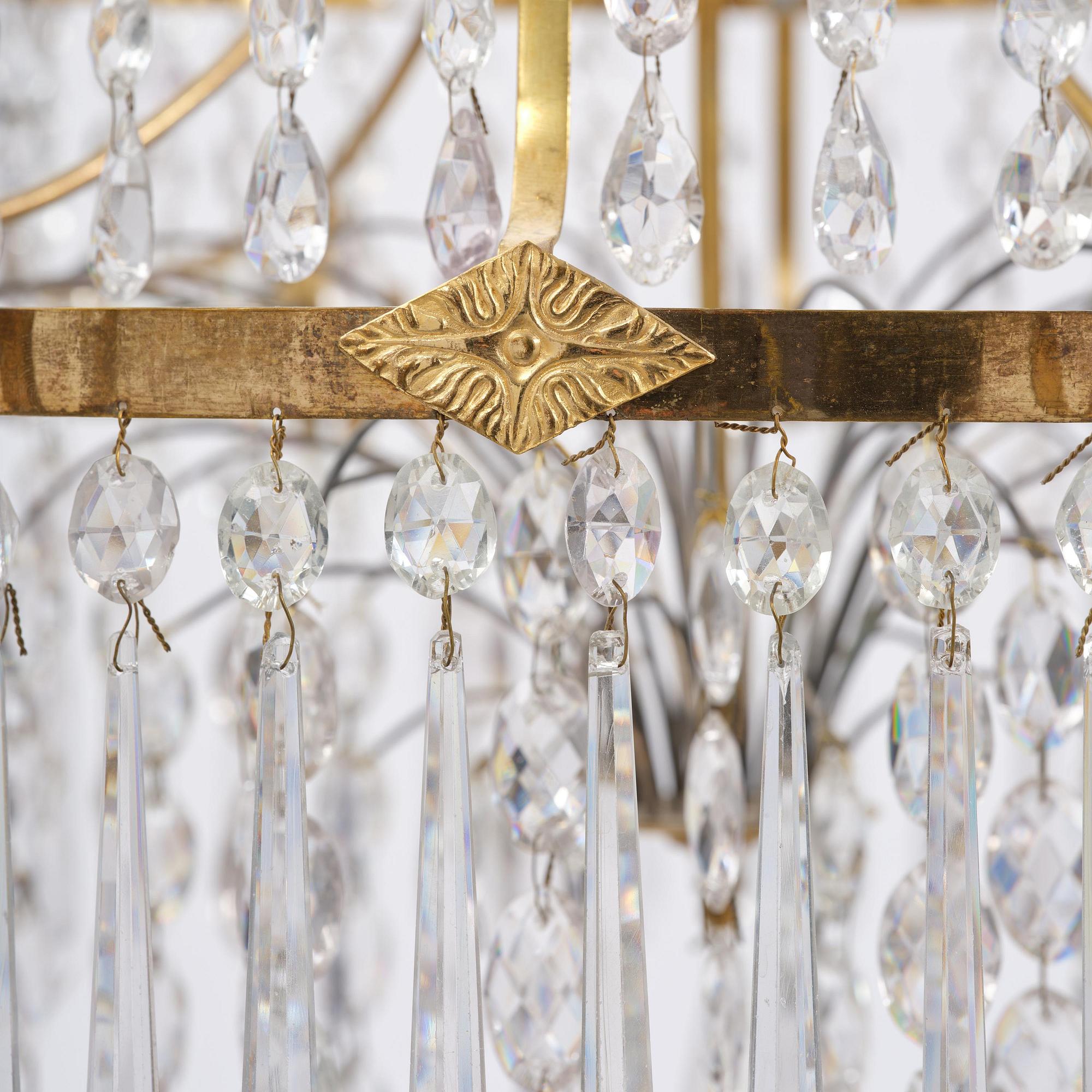 A late Gustavian gilt brass and cut glass eight-branch chandelier, Stockholm, late 18th century.