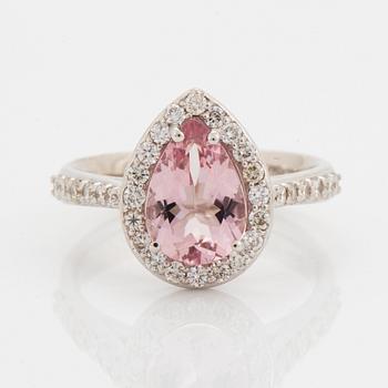 An 18K gold ring set with a faceted morganite.
