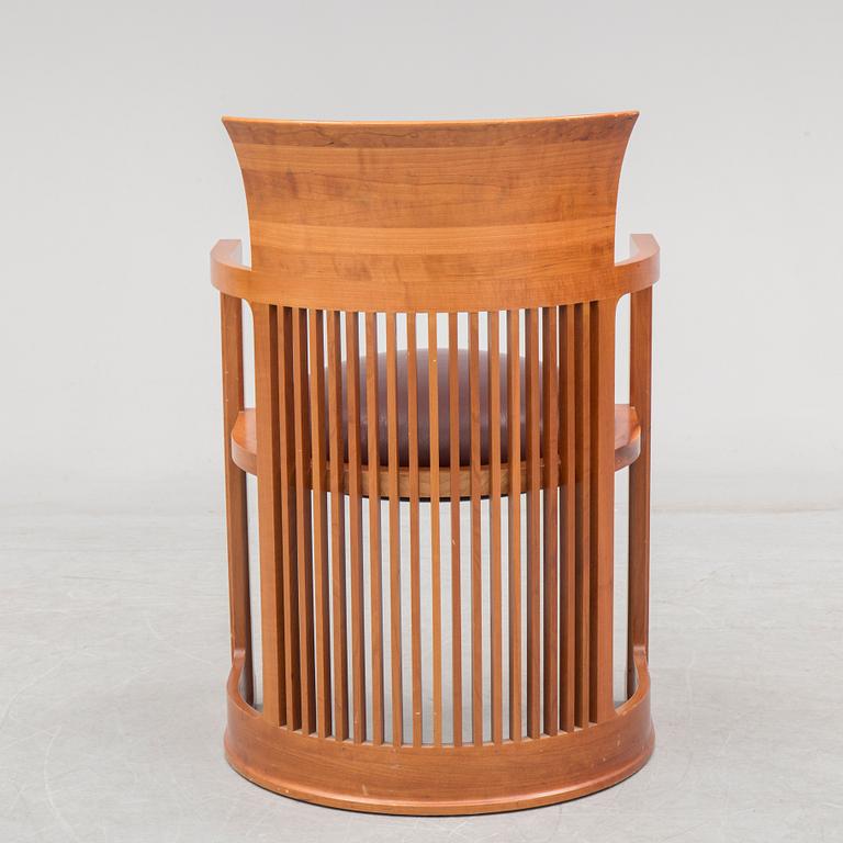 FRANK LLOYD WRIGHT, A cherry wood 'Barrel chair' from Cassina, late 20th century.