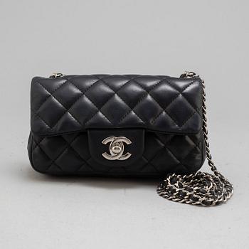 CHANEL, a black leather 'Extra mini flap bag' 2012-13.