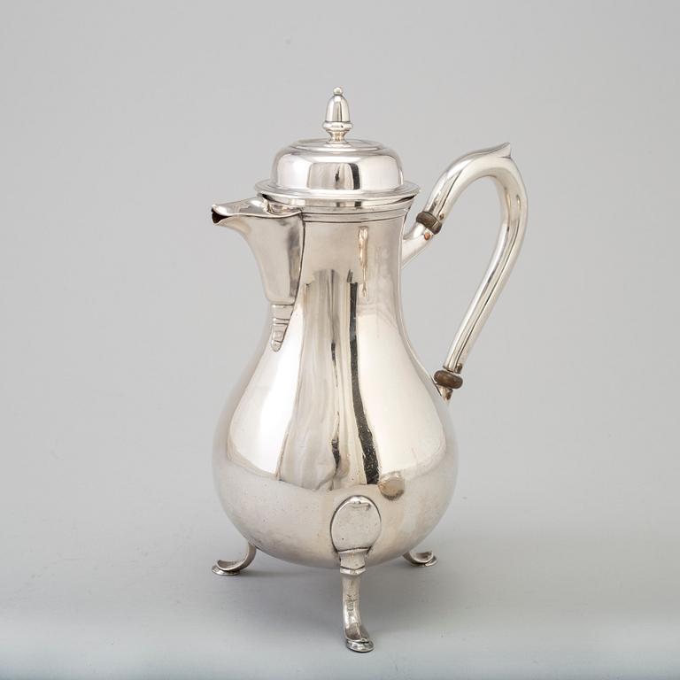 A three-piece silver coffee service from Borel & Co, Germany, mid 20th Century.