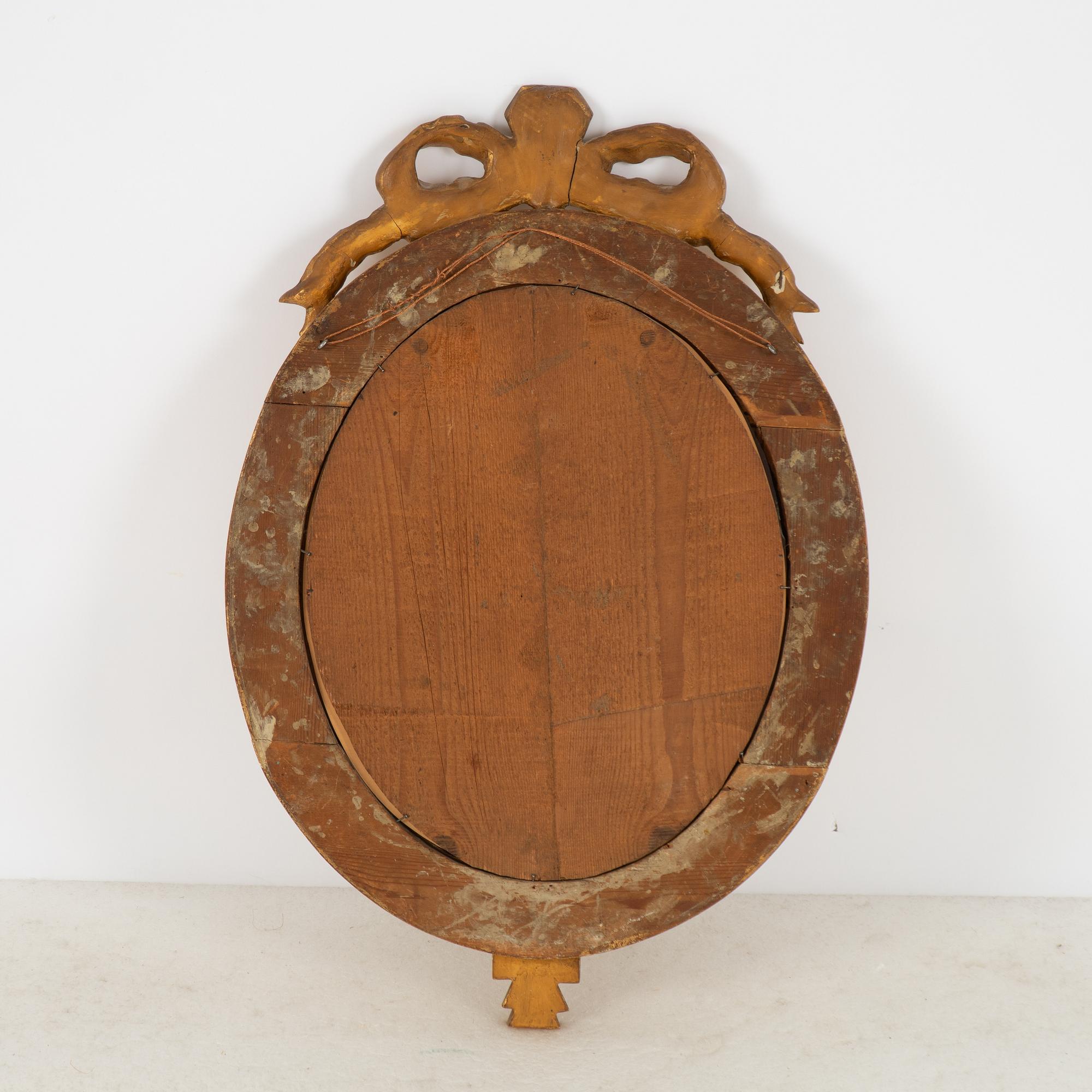 A Gustavian giltwood one-branch girandole mirror, Stockholm, late 18th century.