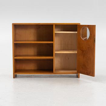 A birch wood book case with cabinet, 1930s.