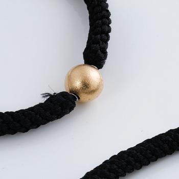 A bracelet, necklace and a clasp by Ole Lynggaard.