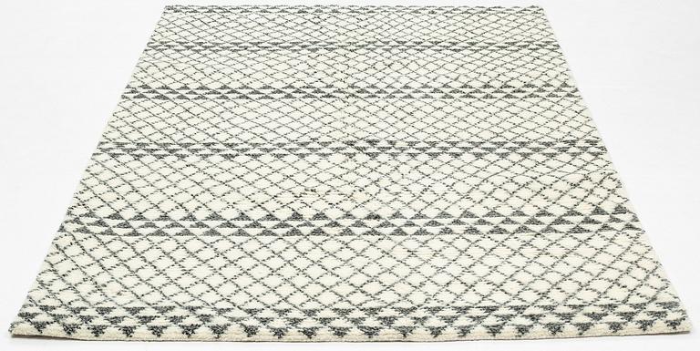 A rug of Moroccan design, ca 245 x 152 cm.