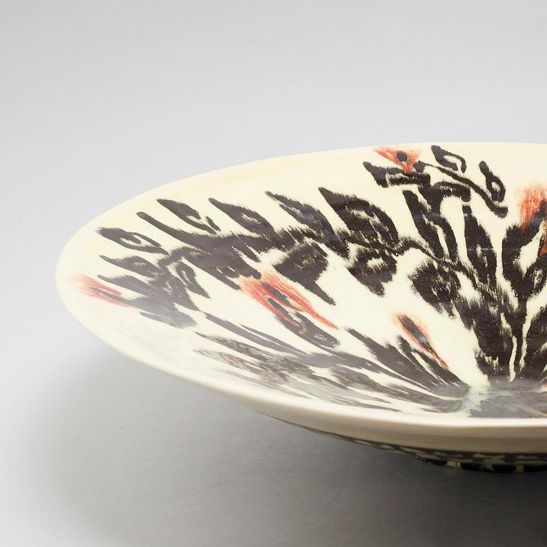 JEAN BESNARD, a glazed ceramic charger, France, signed and dated 1925.