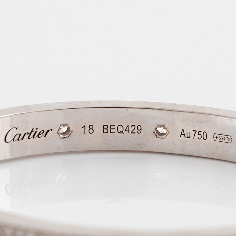 A Cartier "Love" bracelet in 18K white gold set with round brilliant-cut diamonds.